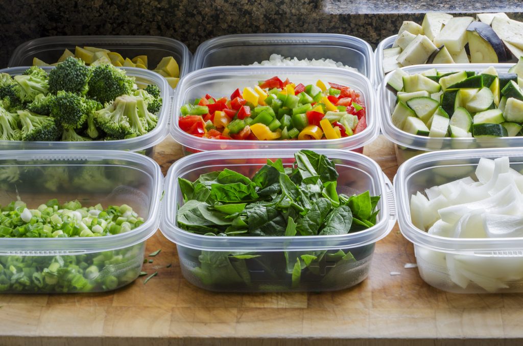 chopped vegetables in plastic containers