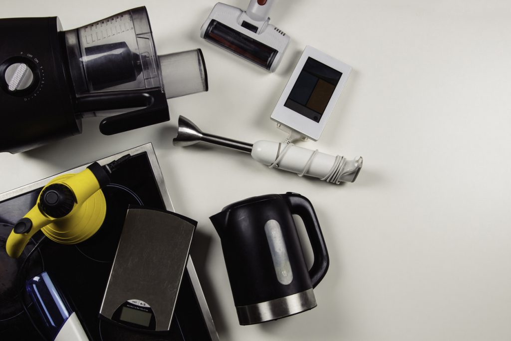 Old household, electrical appliances, broken hob, used electronic gadgets devices on white background. Planned obsolescence, electronic waste for recycling concept. Top view