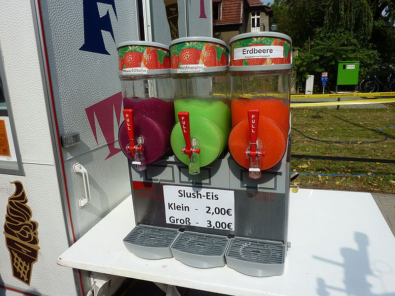 a slushie machine featuring three different flavors