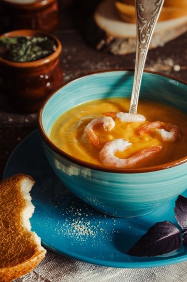 soup or puree on a bowl with shrimps