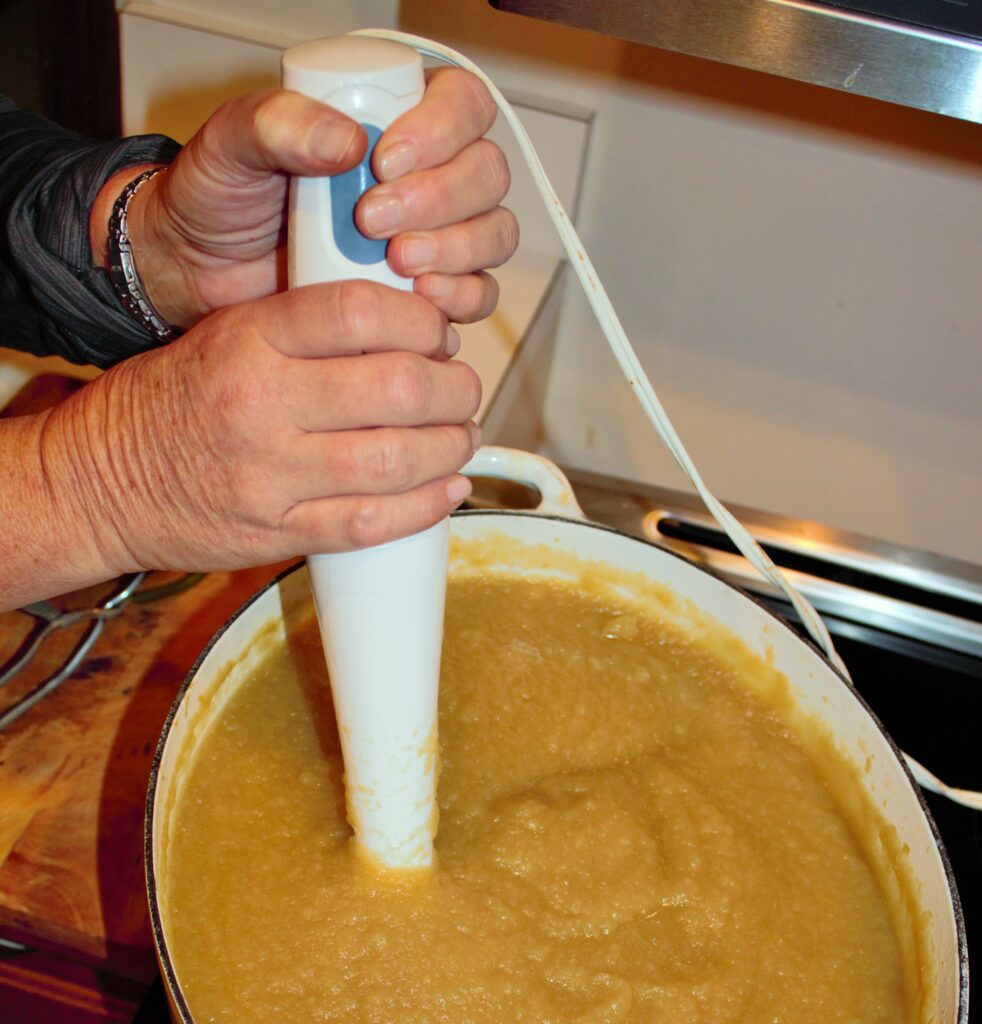 Immersion blender used to puree apple sauce